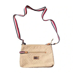 tan Tommy Hilfiger crossbody with red white and blue striped strap